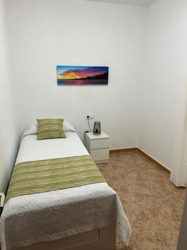 Postel nebo postele na pokoji v ubytování Casa Escanfraga II