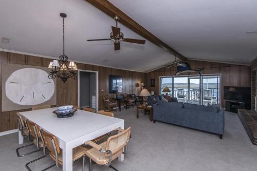 a living room with a table and a couch at Escape in Edisto Island