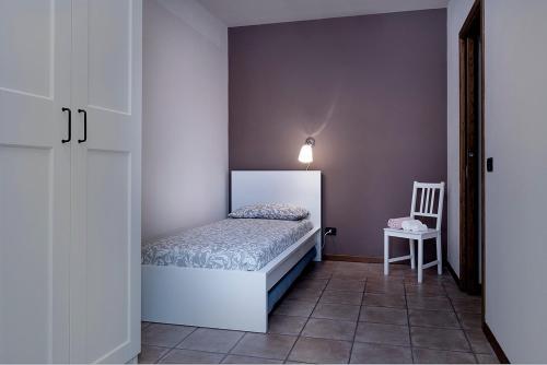 Postel nebo postele na pokoji v ubytování L'Olivo nel Chianti