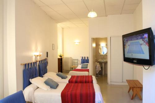 Postel nebo postele na pokoji v ubytování Hotel Christian