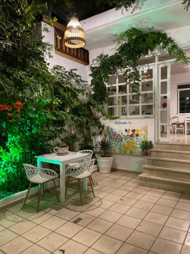 a patio with a table and chairs in front of a building at Matala View in Matala