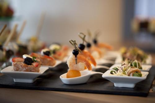 a tray filled with different types of food on a table at Novotel Katowice Centrum in Katowice