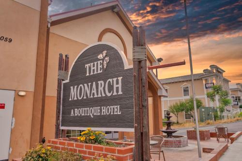 a sign for at The Monarch Inn in Mariposa