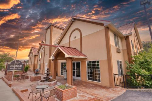 a church building with a sunset in the background at The Monarch Inn in Mariposa