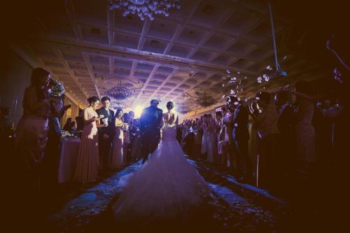 a bride walking down the aisle at a wedding at Centara Grand at Central Plaza Ladprao Bangkok in Bangkok