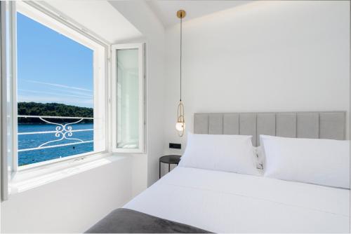 Кровать или кровати в номере La Porta 1, seaview apartment in the center