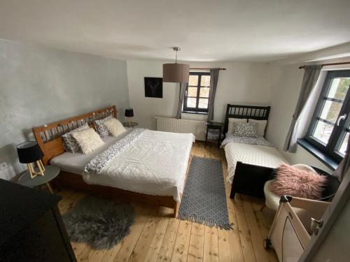 Postel nebo postele na pokoji v ubytování Chalupa Kovářská - Krušné hory