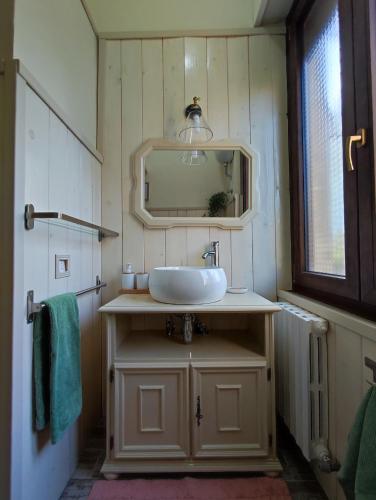 a bathroom with a sink and a mirror at Camere Infinity Rooms in Castelfidardo