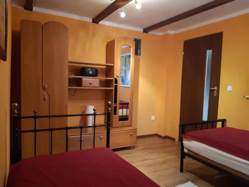 a bedroom with two beds and a mirror at P-4 in Retowo