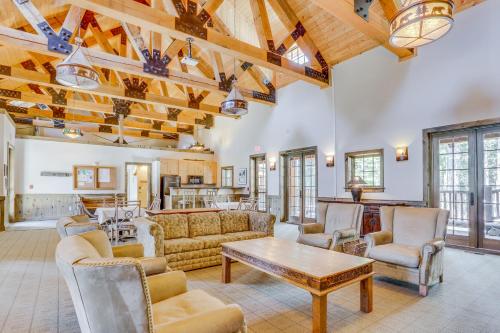 a living room with couches and a table at Collins Lake Condo in Government Camp