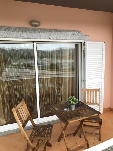 a table and two chairs on a balcony with a table at Lagos Royal Rooms and Suites in Lagos