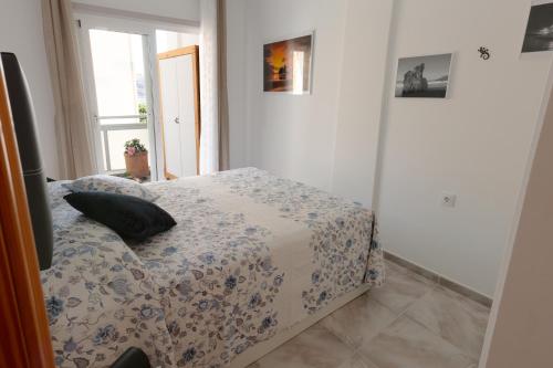 A bed or beds in a room at COQUETO VISTAS AL MAR