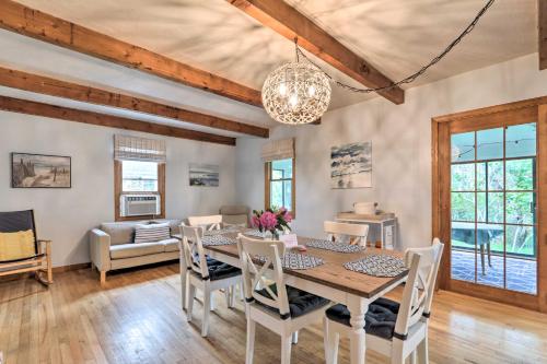 a dining room with a table and chairs at Walk to Beach and Main Street Hyannis Cottage in Barnstable