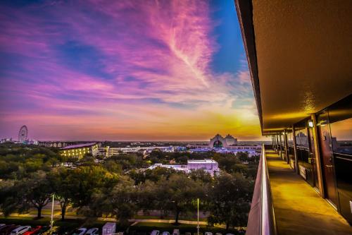 a view of a city at sunset from a building at Rosen Inn at Pointe Orlando in Orlando