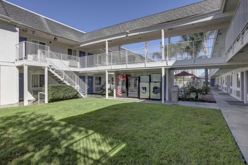 a large house with a lawn in front of it at Motel 6-Westminster, CA - North in Westminster