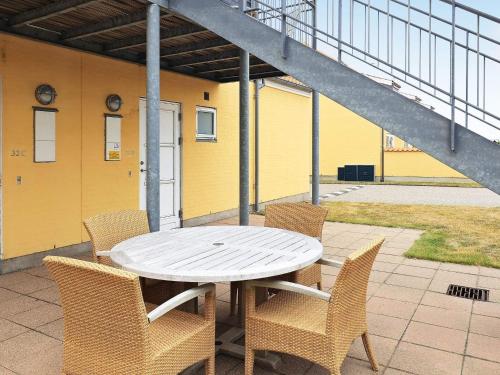 a white table and chairs on a patio at 2 person holiday home in Skagen-By Traum in Skagen