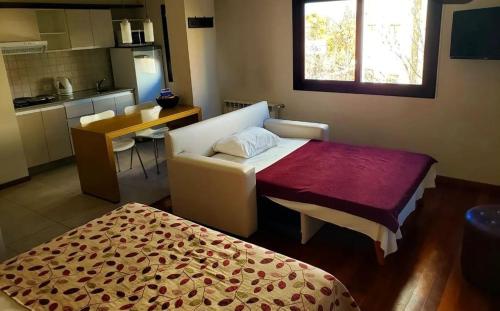 Ein Bett oder Betten in einem Zimmer der Unterkunft Nandó Apart Hotel