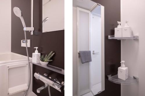 a bathroom with a white toilet and a mirror at japan house sugamo in Tokyo