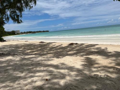 a sandy beach with the ocean in the background at Luxury Studio Rooftop Pool n View unit #4 in Falmouth