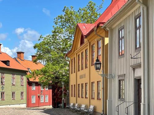 a row of colorful buildings in a street at 4 person holiday home in LINKÖPING-By Traum in Linköping