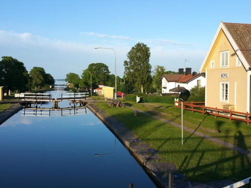 a body of water with a building and a house at 4 person holiday home in LINKÖPING-By Traum in Linköping