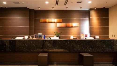 a lobby of a hotel with a reception counter at Via Inn Shinagawa Oimachi in Tokyo