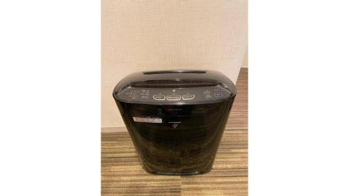 a toaster sitting on top of a floor at Via Inn Higashiginza in Tokyo