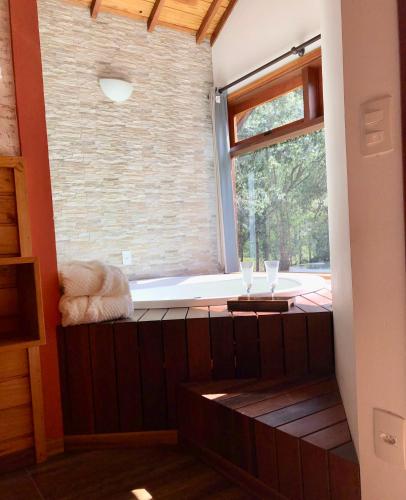 a room with a window with two wine glasses at Afha 48 in Monte Verde