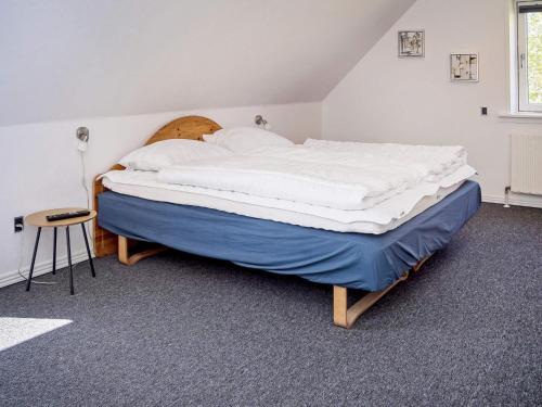 Postel nebo postele na pokoji v ubytování Holiday home Roslev XXII