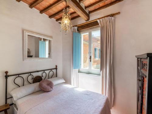 A bed or beds in a room at Holiday Home Gioiella near Trasimeno Lake