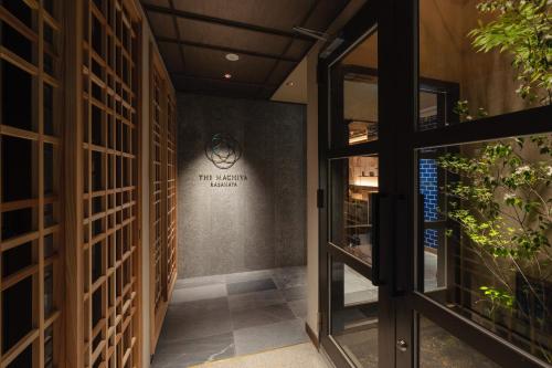 a hallway with a door leading to a wine cellar at THE MACHIYA KAZAHAYA in Kyoto