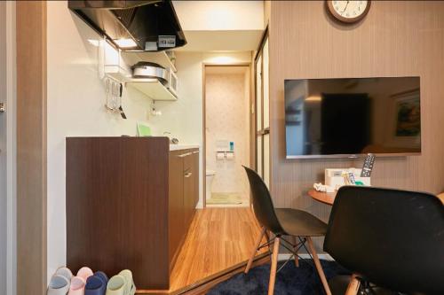 Keigen buildingにあるテレビまたはエンターテインメントセンター
