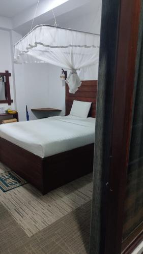 Ένα ή περισσότερα κρεβάτια σε δωμάτιο στο Cozy Homestay