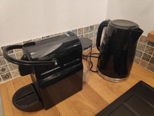 a black toaster sitting on top of a counter at Przystanek Gorce in Nowy Targ