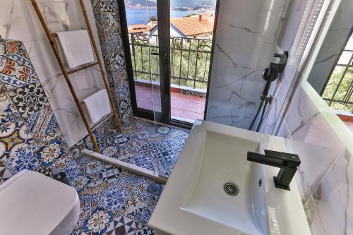 a bathroom with a sink and a toilet at BARBARA SVETI STEFAN in Sveti Stefan