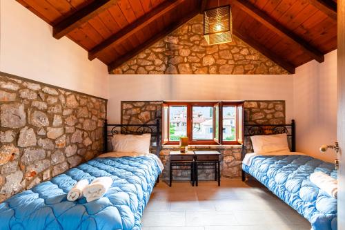 Postel nebo postele na pokoji v ubytování Seaside Dukes Villas