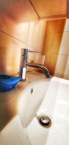 a bathroom sink with a faucet on top of it at Casina Raho B&B in Nardò