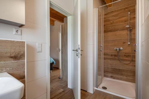 a bathroom with a shower and a sink at Seeblick Warin in Warin