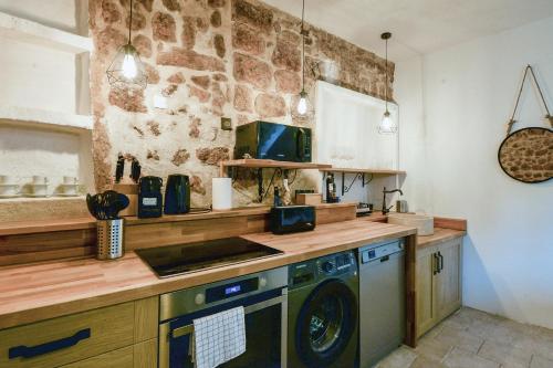 a kitchen with a washer and dryer on a counter at Lovely apartment in Saint-Paul-De-Vence in Saint Paul de Vence