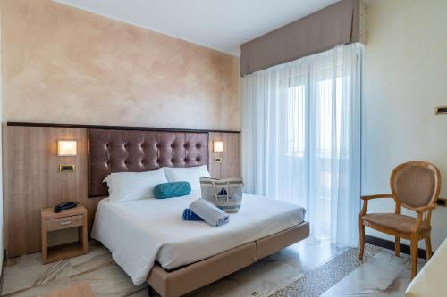 Postel nebo postele na pokoji v ubytování Hotel Gambrinus - Valentini Family Village