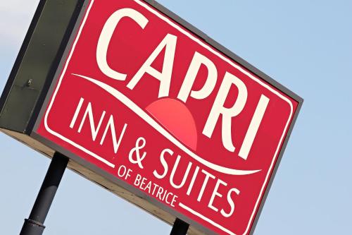 a red sign for a carmitemite and sunrise initiative at Capri Inn & Suites - Beatrice in Beatrice