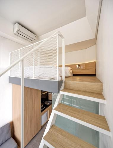 a small bedroom with a bunk bed in a house at Sakura Terrace Benhil in Jakarta