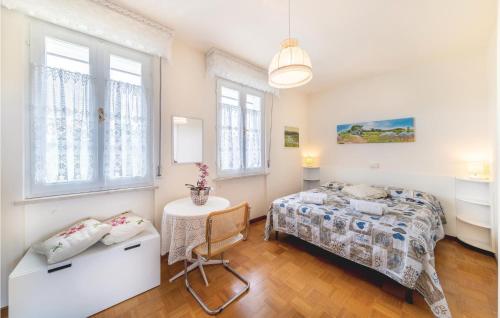 a bedroom with a bed and a table at Casa Katia in Lazise