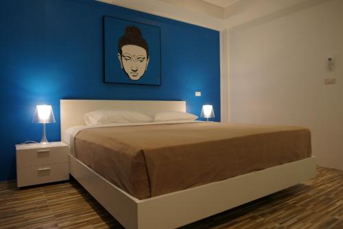 Кровать или кровати в номере Lotus Art Guesthouse