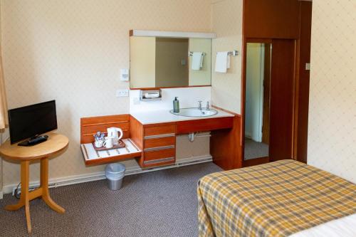TV a/nebo společenská místnost v ubytování Alexandra Hotel