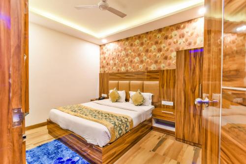 a bedroom with a bed and a glass door at Olivia Stay in New Delhi
