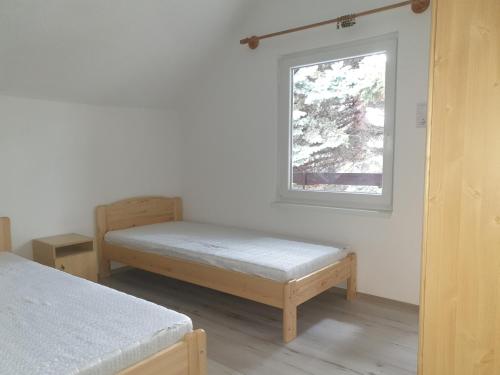 Posteľ alebo postele v izbe v ubytovaní Szépvölgyi Apartmanház