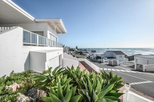 a view of the ocean from the balcony of a house at 13 on Main in Yzerfontein