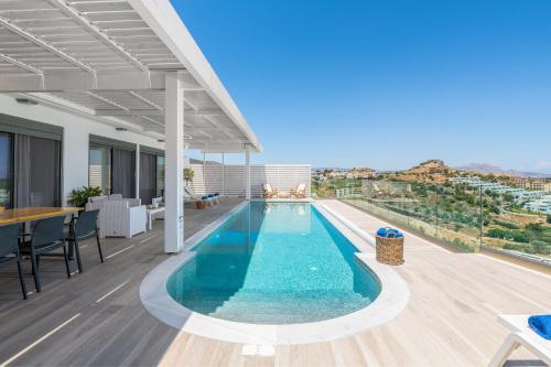 a swimming pool on the roof of a building at Villa Faros in vlicha