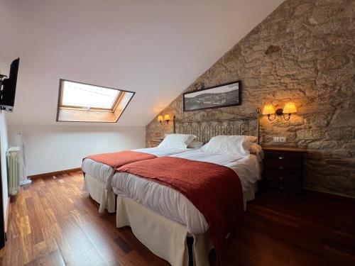 Postel nebo postele na pokoji v ubytování Hotel Rústico Finisterrae